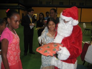 875 GFLF members look on as Santa puts smiles on the children's faces