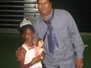 IMG_2637 GFLF hardworking member shares a photo with a little princess from Jesus cares family Cottage
