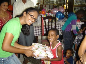 All smiles as friend of GFLF distributes the gifts